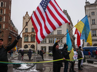 Ukrainian citizens and supporters attend a demonstration of solidarity with Ukraine at the Main Square, while celebrating Ukrainian Unity Da...