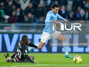 Pierre Kalulu of AC Milan and Pedro of SS Lazio compete for the ball during the Serie A match between SS Lazio and AC Milan at Stadio Olimpi...