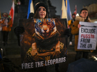A protester holding a poster with words 'Free The Leopards' is seen during the 'Protest in Support of Ukraine' on the Main Market Square in...