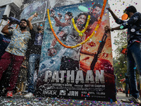 Fans of Bollywood actor Shah Rukh Khan celebrate the release of Shah Rukh Khan-starrer Hindi-language film ''Pathaan'', ahead of the first d...