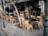 Empty tables of a coffee shop due to low temperatures in Athens, Greece on January 25, 2023. (