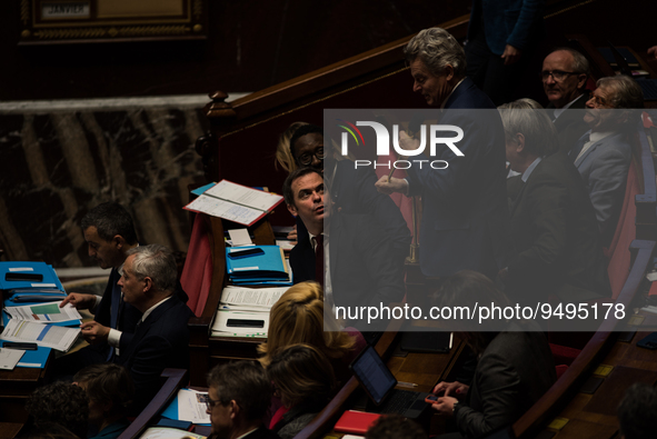 NUPES deputy Fabien Roussel takes the floor under the critical gaze of government spokesman Olivier Veran, during the question session to th...
