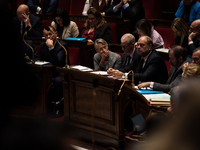 The benches of the government majority with PM Elisabeth Born in the centre, covering her mouth with her hand, during the question session t...