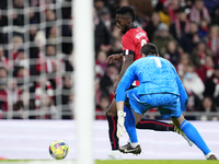 Iñaki Williams centre-forward of Athletic Club and Ghana and Thibaut Courtois goalkeeper of Real Madrid and Belgium compete for the ball dur...