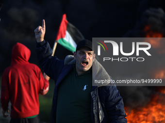 Palestinians react during clashes with Israeli forces, near the Israel-Gaza border east of Gaza City, January 26, 2023.
 (