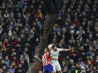 Reinildo Mandava of Atletico de Madrid in action with Nacho Fernandez of Real Madrid during the Copa del Rey match between Real Madrid and A...