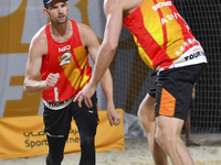 Alexander Brouwer (R) and Robert Meeuwsen (L) of Netherlands react during the men's Volleyball World Beach Pro Tour Finals against Paolo Nic...