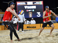 Alexander Brouwer (R) and Robert Meeuwsen (L) of Netherlands action during the men's Volleyball World Beach Pro Tour Finals against Paolo Ni...