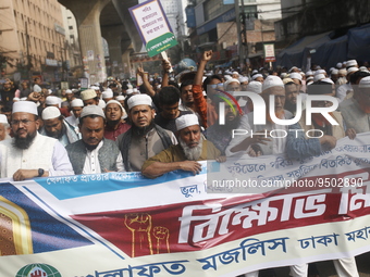 Activists of Bangladesh Khelafat Majlis take part in a protest against the burning of the holy Koran in Sweden, in Dhaka, Bangladesh on Janu...