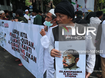 Hundreds of  Indonesian Muslims demonstrated in protest against the burning of the Koran by a Swedish politician with accompanied symbol the...