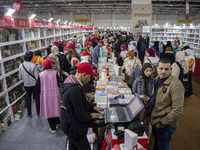 People visit the Cairo International Book Fair at Egypt's International Exhibition Center in Cairo, Egypt, 26 January 2023. Some 51 countrie...