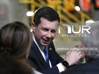 US SEcretary of Transportation Pete Buttigieg sepaks with guests prior to US President Joe Biden's discussion about funding for the “Hudson...