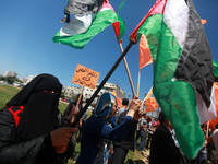 Palestinian demonstrators chant slogans against Israel's opposition to the Palestinian political reconciliation, in Gaza City, on April 30,...