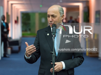 French Foreign Affairs minister Laurent Fabius speaks to the press during the United Nations conference on climate change (COP21) in Le Bour...