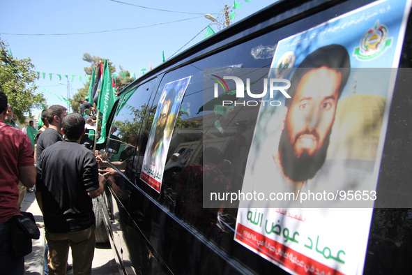 RAMALLAH, PALESTINE -April 30, 2014: Palestinian mourners attend the funeral of the two Hamas members Adel and Imad Awadallah who was report...