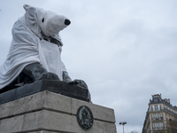 The famous statue of the Lion of Denfert Rochereau square was disguised into a Polar Bear. 2015/12/10. Paris. (