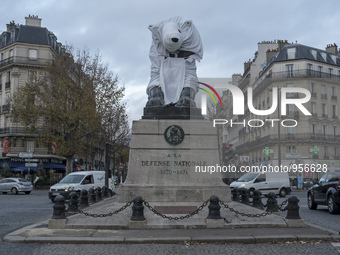 The famous statue of the Lion of Denfert Rochereau square was disguised into a Polar Bear. 2015/12/10. Paris. (