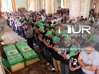 RAMALLAH, PALESTINE -April 30, 2014: Palestinians are performing the funeral prayers on the two Hamas members Adel and Imad Awadallah who wa...