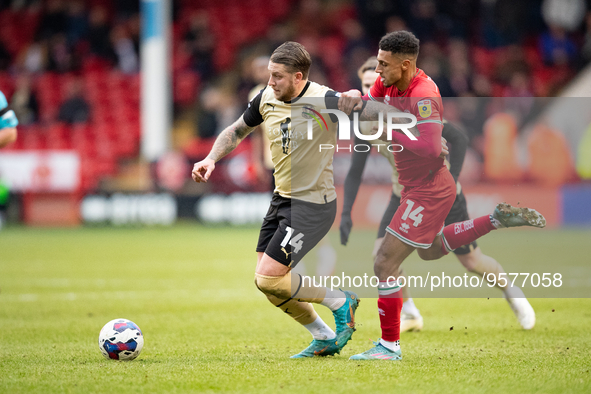 George Moncur of Leyton (L) and Walsall's Brandon Comley  during the Sky Bet League 2 match between Walsall and Leyton Orient at the Banks's...