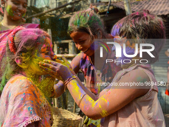 Two girls are seen smearing each other with colored powder during Holi celebration in Kolkata , India , on 5 March 2023 . People of Kolkata...