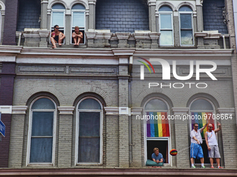 Gays and Lesbians watch the annual pride parade from their windows on Church Street in downtown Toronto during Gay Pride festivities in Cana...