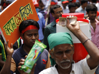 An ice-cream seller into may day rally.
Garment workers & other labor organization in Bangladesh shout slogans during the May day celebratio...