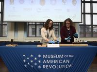 Museum staff presents artifacts during a repatriation ceremony for the return of a cache of fifty historic weapons recovered by the FBI Art...