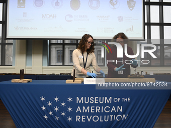 Museum staff presents artifacts during a repatriation ceremony for the return of a cache of fifty historic weapons recovered by the FBI Art...