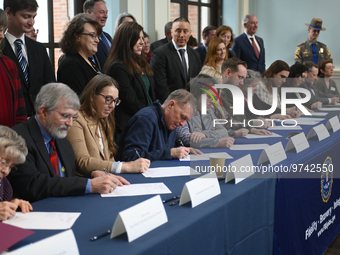 Representatives of historic societies and musea sign a Receipt of Property from the U.S. Department of Justice Federal Bureau of Investigati...