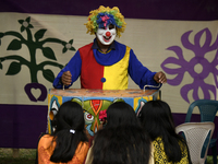 Students enjoy a puppet show at the Teacher-Student Centre of Dhaka University as they experience traditional festivals of rural Bengal at a...