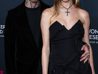 American singer and songwriter Adam Levine of American pop rock band Maroon 5 and wife/Namibian model Behati Prinsloo arrive at The Women's...