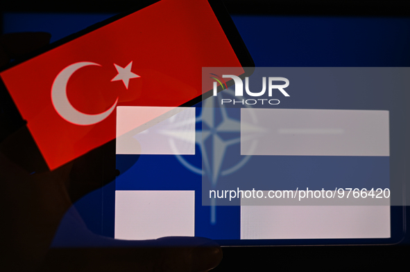 NATO logo seen together with the flag of Finland and Turkey, seen in this photo illustration. On 18 March 2023 In Brussels, Belgium. (Photo...
