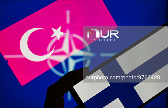 NATO logo seen together with the flag of Finland and Turkey, seen in this photo illustration. On 18 March 2023 In Brussels, Belgium. (Photo...