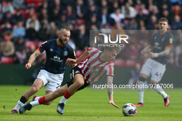 Sunderland's Jack Clarke turns from Luton Town's Allan Campbell during the Sky Bet Championship match between Sunderland and Luton Town at t...
