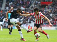 Luton Town's Cody Drameh is challenged by Sunderland's Luke O'Nien during the Sky Bet Championship match between Sunderland and Luton Town a...