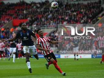 Luton Town's Fred Onyedinma chases Sunderland's Amad Diallo during the Sky Bet Championship match between Sunderland and Luton Town at the S...