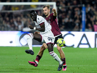 Norbert Gyomber of US Salernitana and Musa Barrow of Bologna FC compete for the ball during the Serie A match between US Salernitana and Bol...