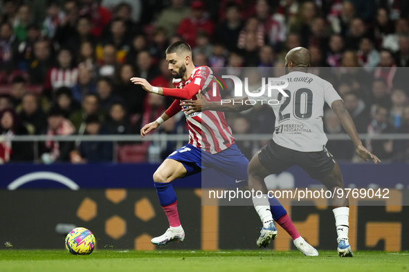 Yannick Carrasco left winger of Atletico de Madrid and Belgium and Dimitri Foulquier right-back of Valencia and Guadeloupe compete for the b...
