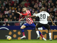 Yannick Carrasco left winger of Atletico de Madrid and Belgium and Dimitri Foulquier right-back of Valencia and Guadeloupe compete for the b...