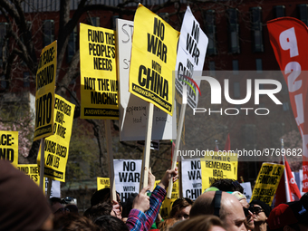 Demonstrators march in Washington, D.C. on March 18, 2023 during an anti-war protest organized by the Answer Coalition and dozens of other g...