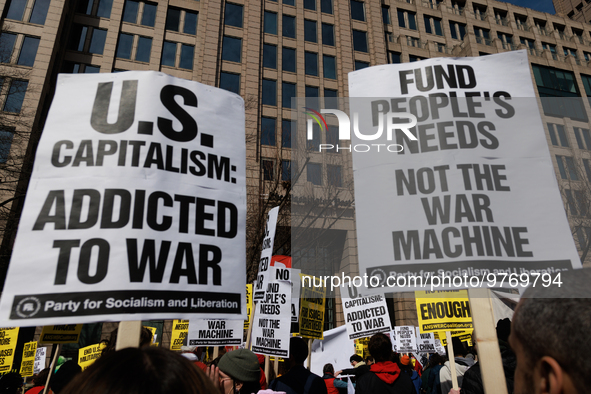 Demonstrators protest outside of the offices of The Washington Post in Washington, D.C. on March 18, 2023 during an anti-war march organized...