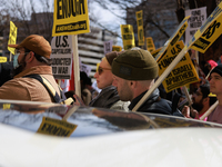 Demonstrators protest outside of the offices of The Washington Post in Washington, D.C. on March 18, 2023 during an anti-war march organized...