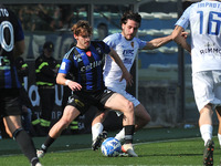 Matteo Tramoni (Pisa) thwarted by Maxime  Leverbe (Benevento) during the Italian soccer Serie B match AC Pisa vs Benevento Calcio on March 1...