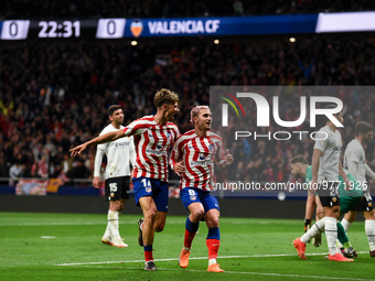 Marcos Llorente and Antoine Griezmann celebrates a goal during La Liga match between Atletico de Madrid and Valencia CF at Civitas Metropoli...