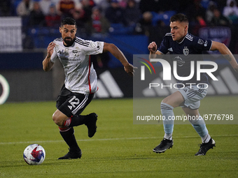 March 18, 2023, Frisco, United States: FC Dallas midfielder Sebastian Lletget is chased by Sporting KC midfielder Remi Walter during first h...