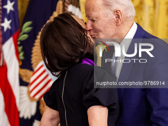 President Joe Biden presents Julia Louis-Dreyfus with the National Medal of the Arts during a White House ceremony awarding medals in the ar...