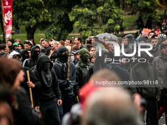 Demonstrators clash with the police during a march held in the framework of May Day on May 1, 2014 in Santiago, Chile. (