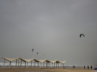 Kite surfers in the Mediterranean Sea on a stormy weather in the coastal city Herzliya, North of Tel-Aviv on January 08, 2016.  (