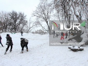 Kids plays a snowball at a park downtown Kyiv, on January 9, 2016. Storm warning announced in Ukraine by Hydrometeorological Center (