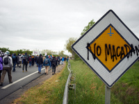 A sign reads 'No macadam'. More than 8000 protesters marched 12km against the planned A69 highway. The collectives 'La Voie Est Libre' (ie '...